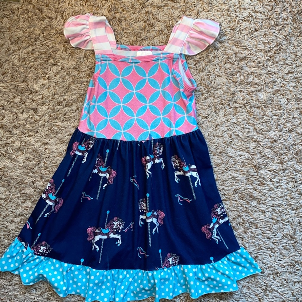 3t girls sleeveless dress with carousel horse pattern.